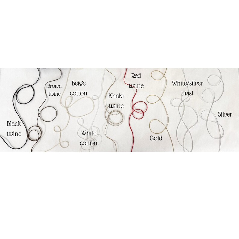 May include: A collection of twines and cotton threads in various colors, including black, brown, beige, white, khaki, red, gold, silver, and white/silver twist. Each thread is labeled with its color name.