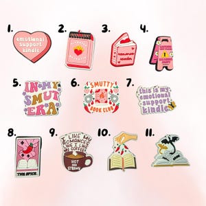 May include: A selection of shoe charms with diverse designs and text. The charms feature a heart with "emotional support kindle", a book, a coffee cup, and a dragon on a book. Colours include pink, red, and brown.
