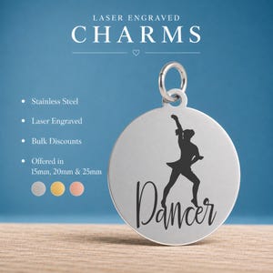 May include: A circular silver-toned stainless steel charm featuring a laser-engraved silhouette of a dancer and the word Dancer in script font. The charm includes a jump ring and is available in 15mm, 20mm, and 25mm sizes in silver, gold, and rose gold.