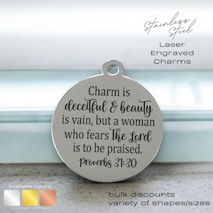 May include: A silver charm with the text "Charm is deceitful & beauty is vain, but a woman who fears The Lord is to be praised. Proverbs 31:30" engraved on it.