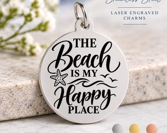 May include: A round stainless steel charm featuring a laser-engraved design with the text "THE Beach IS MY Happy PLACE," a starfish, and wave icons. The charm includes a jump ring at the top and is presented alongside color options for silver, gold, and rose.