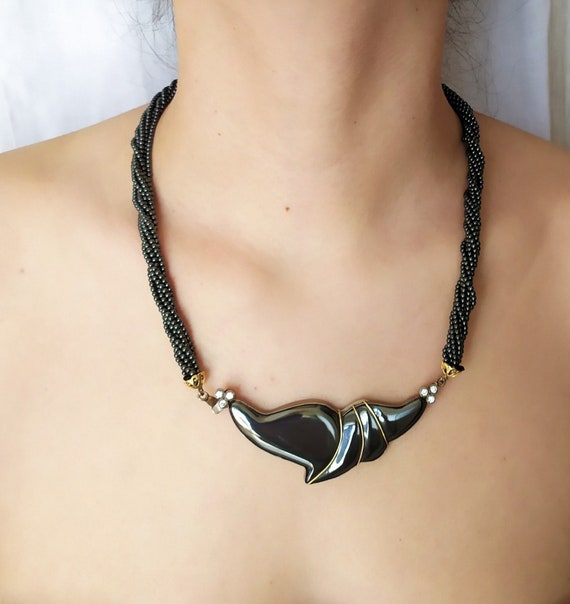 Hematite Multi Strand Beaded Necklace With Large Carved Pendant