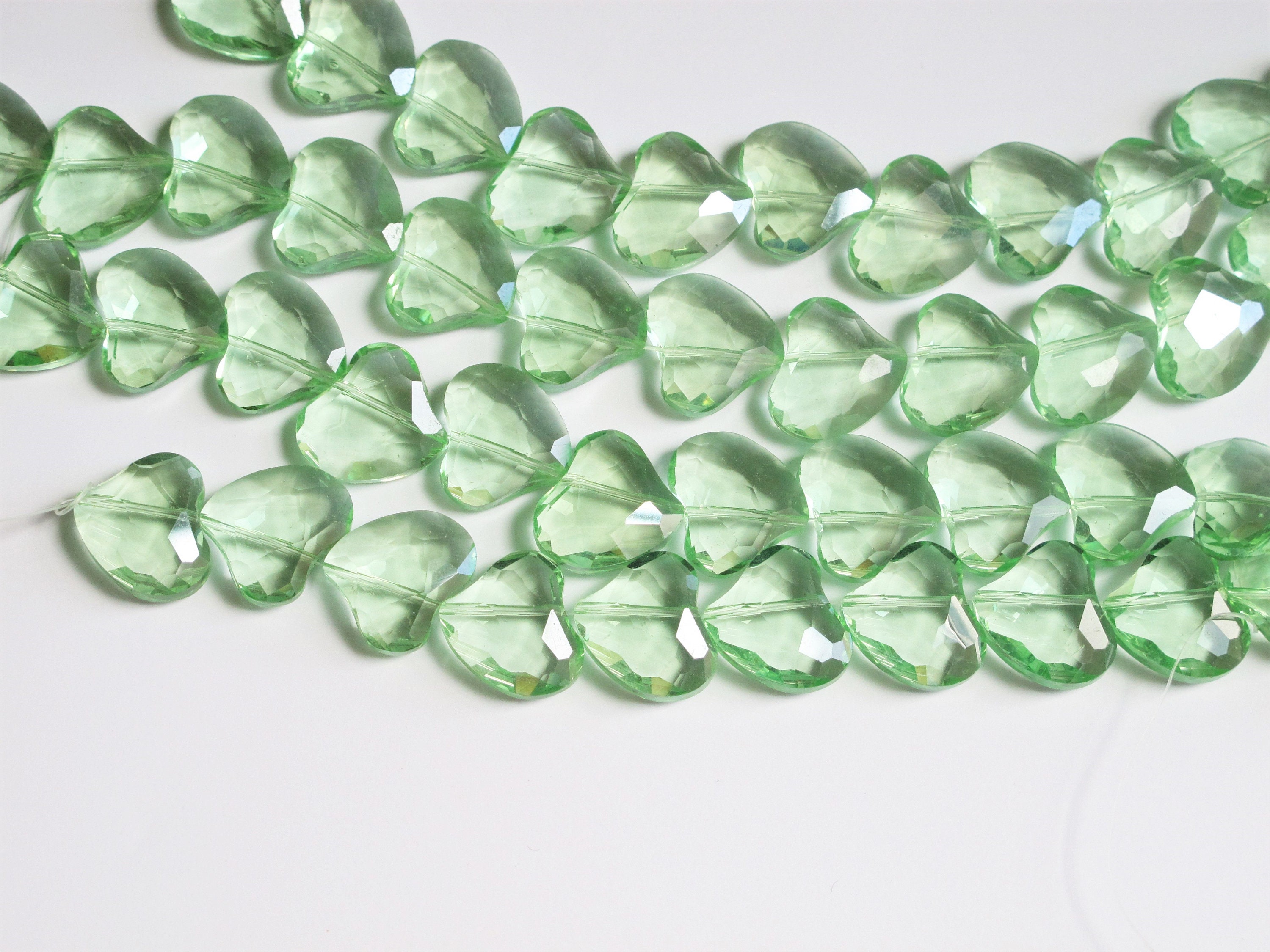 Green crystal beads. Spring green glass faceted heart beads 20mm. Eight pieces