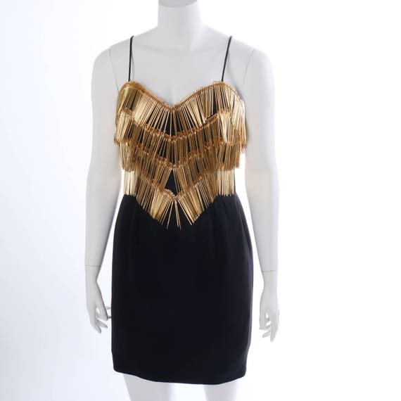 Vintage golden Needle dress designed by 