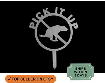 May include: Metal yard sign with a circle and a dog silhouette inside. The circle has a diagonal line through it and the words "Pick It Up" around the outside. The sign is on a black background.
