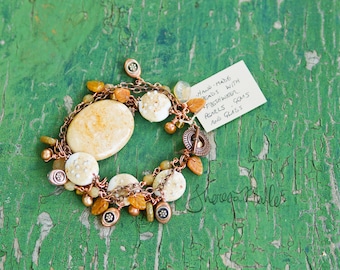 Painted Desert - Jasper and artglass bracelet features faceted, copper and leaf-shaped beads and freshwater pearls. Tierra cast clasp.