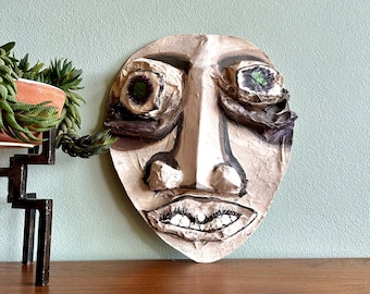 Large, wacky paper mache mask wall hanging / handmade outsider art green-eyed face