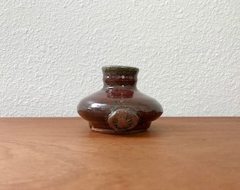 Vintage studio pottery bud vase / deep red handmade pot with sunburst mark