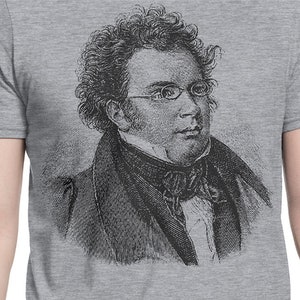 May include: A black and white engraving of a man with curly hair wearing glasses and a suit.