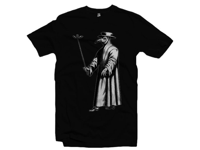 May include: Black t-shirt featuring a white graphic of a plague doctor wearing a long coat and a beak mask, holding a long stick with a bird on top.