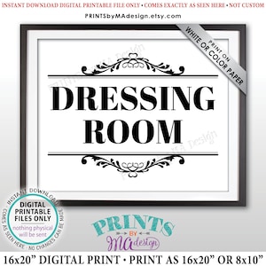May include: A framed digital print with the words "DRESSING ROOM" in bold black letters on a white background. The print includes decorative flourishes above and below the text, and the frame is black. The print is available as a 16x20 inch or 8x10 inch digital file.
