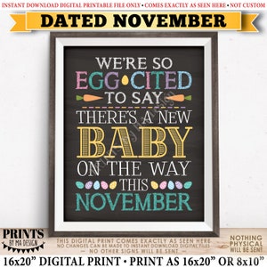 May include: A printable sign announcing a new baby is on the way in November. The sign is decorated with colorful eggs and carrots and has a chalkboard background. The text reads "We're so egg-cited to say there's a new baby on the way this November."