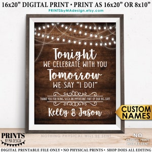 May include: A printable sign with a rustic wood background and white string lights. The text reads "Tonight we celebrate with you. Tomorrow we say "I do!" Thank you for being such an important part of our big day! Kelly & Jason".