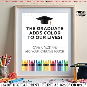 May include: A framed digital print with the text "THE GRADUATE ADDS COLOR TO OUR LIVES!" and "GRAB A PAGE AND ADD YOUR CREATIVE TOUCH!". The print features a graduation cap, a row of colorful crayons, and the text "16x20" DIGITAL PRINT".