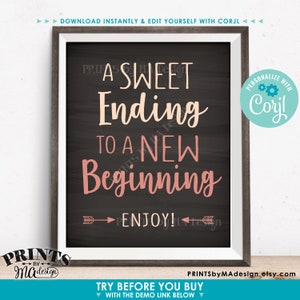 Puede incluir: Impresi&oacute;n enmarcada con el texto "A Sweet Ending to a New Beginning" en letras blancas y rosas sobre un fondo gris oscuro. La impresi&oacute;n incluye la palabra "Enjoy!" y flechas decorativas. El marco es marr&oacute;n oscuro.