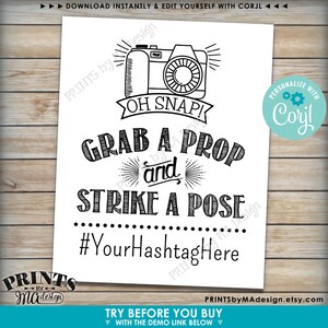 May include: Black and white printable sign with a camera graphic and the text "Oh Snap! Grab a Prop and Strike a Pose #YourHashtagHere".