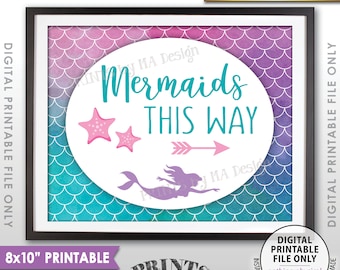 May include: Printable 8x10 inch sign with a mermaid, two starfish, and an arrow pointing right. The sign has a teal, purple, and pink watercolor background with a mermaid scale pattern. The text on the sign reads "Mermaids This Way".