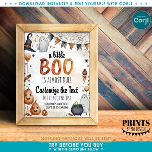 Op de afbeelding: Een ingelijste Halloween-print met een houten frame. De print bevat de tekst "a little BOO is almost due!" met aanpasbare tekstopties. Illustraties zijn onder meer pompoenen, geesten en een heksenhoed. Het ontwerp staat tegen een witte achtergrond.