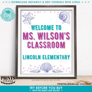 May include: Printable classroom welcome sign with a teal and purple color scheme. The sign says "Welcome to Ms. Wilson's Classroom, Lincoln Elementary". The sign is decorated with seashells and starfish.