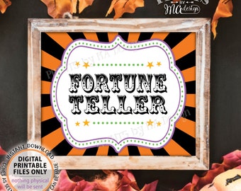 May include: A framed digital print with the words "FORTUNE TELLER" in a vintage font. The design features an orange and black striped background, a white and purple border, and star accents. The print is available in 40.6x50.8 or 20.3x25.4 cm sizes.