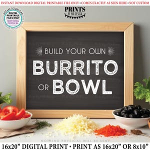 May include: A framed chalkboard sign with the text "BUILD YOUR OWN BURRITO OR BOWL" in white. The sign is surrounded by ingredients like tomatoes, cheese, and olives. The sign is a digital print.