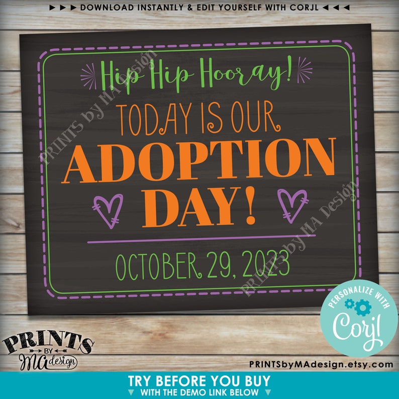 May include: A chalkboard sign with the text "Hip Hip Hooray! Today is our Adoption Day!" in green, orange, and purple text. The date "October 29, 2023" is written in purple text below the main text.