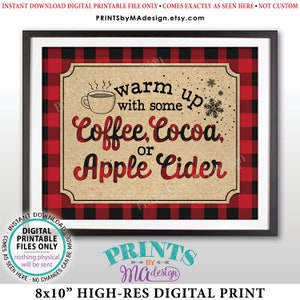 May include: Framed 8x10 inch digital print with a red and black buffalo plaid border. The print features the text "warm up with some Coffee, Cocoa, or Apple Cider" with a coffee cup and snowflake graphic.