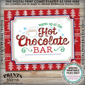 May include: A printable sign with a red and white knitted pattern border. The sign says "Warm up at the Hot Chocolate Bar" in a white font with a red outline. The text is surrounded by a green and blue border.