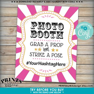 May include: A printable photo booth sign with pink and white stripes. The sign says "Photo Booth", "Grab a Prop and Strike a Pose", and "#YourHashtagHere".