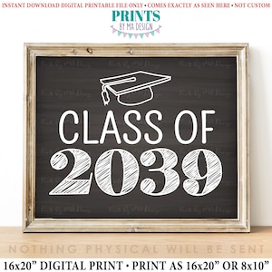 May include: A framed chalkboard-style digital print with the text "CLASS OF 2039" in white, along with a graduation cap illustration. The print is designed to be 16x20 inches or 8x10 inches. The phrase "PRINTS BY MA DESIGN" is at the top.