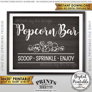 May include: Printable sign for a popcorn bar with a chalkboard background. The sign says "Popcorn Bar" in white text with a decorative border of popcorn kernels. The text "Scoop. Sprinkle. Enjoy" is below the main text. The sign is framed in a white frame.