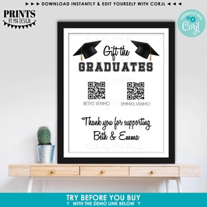 May include: A framed graduation gift print with a black border. The print features the text "Gift the GRADUATES" with two graduation caps. Below are QR codes and the text "Beth's Venmo" and "Emma's Venmo". The bottom reads "Thank you for supporting Beth & Emma."