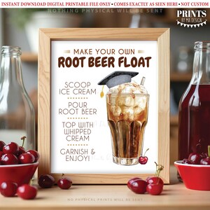 Puede incluir: Una impresi&oacute;n enmarcada con instrucciones para hacer un root beer float. El texto dice "Make Your Own Root Beer Float" con los pasos: helado, verter root beer, cubrir con crema batida y adornar y disfrutar. Se incluye un dibujo de un root beer float con un birrete.