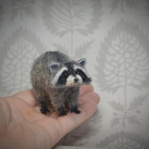 Miniature wool raccoon – handcrafted needle felt sculpture
