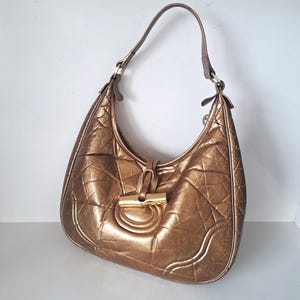 Longchamp Bronzene Hobo Schultertasche aus gestepptem Leder mit goldenen Metallteilen