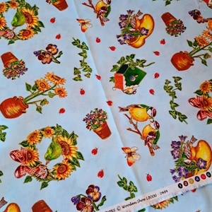 May include: Light blue fabric with a repeating pattern of sunflowers, birds, flower pots, butterflies, and ladybugs. The fabric also features wreaths, birdhouses, and trailing vines. The text "LEHMANN & WEBER COLLECTIONS Wooden Shoe L8000 0484" is printed on the edge.