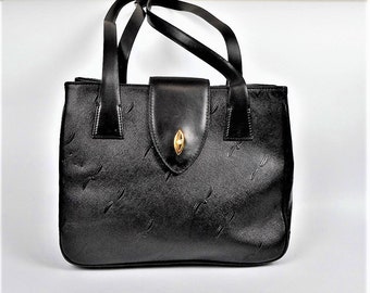 Vintage handgemaakte Aiku leren tas uit Italië met zwarte handvatten, retro modeaccessoire.