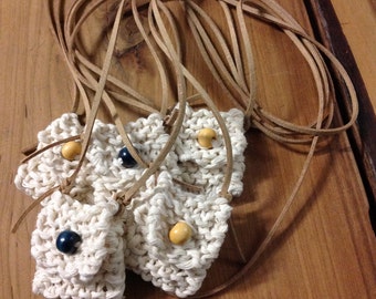 Cotton amulet necklace.