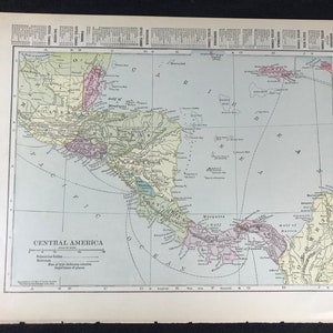 May include: A vintage map of Central America, printed in black, brown, green, pink, and blue ink on a white background. The map shows the countries of Guatemala, Belize, Honduras, Nicaragua, Costa Rica, and Panama. The map also shows the Caribbean Sea, the Pacific Ocean, and the Gulf of Mexico. The map is titled "Central America" and includes a scale of miles, a key to administrative divisions, and a key to important places.