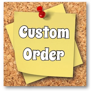 May include: A yellow sticky note with the text "Custom Order" written in white, bold letters. The note is pinned to a corkboard with a red pushpin.