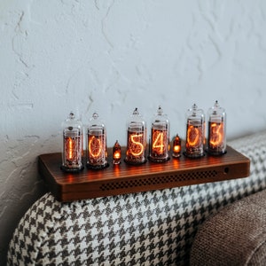 IN-14 Nixie clock in slim wooden enclosure with a clear plastic bottom cover.