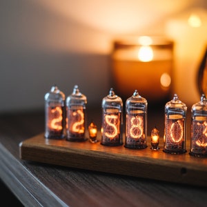 IN-14 Nixie clock in slim wooden enclosure with a clear plastic bottom cover.