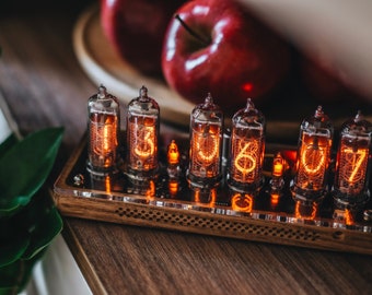 IN-14 Nixie clock in slim perforated wooden case with clear plastic top cover.