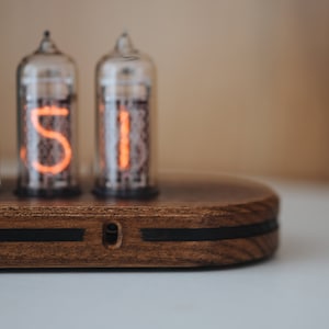 The slim time capsule - IN-14 Nixie clock in wooden case with a plastic bottom cover