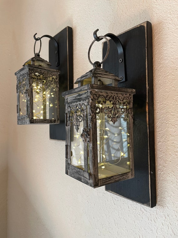 Hanging lantern top wall sconce