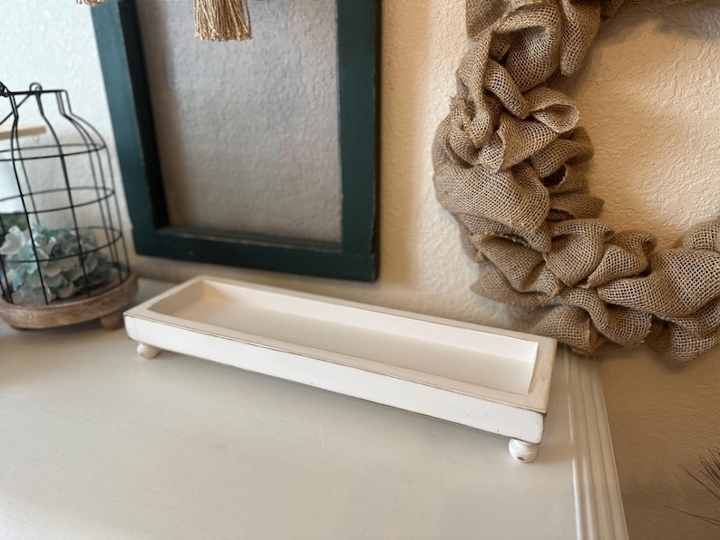 Rustic handcrafted wooden tray with smooth edges and a natural finish, available in customizable colors. The tray features a simple elegant design, perfect for serving as a decorative piece in any room.