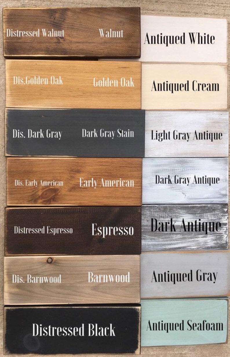 May include: A wood stain color chart with 12 different wood stain colors. The colors are labeled with names like "Distressed Walnut", "Walnut", "Antiqued White", "Dis. Golden Oak", "Golden Oak", "Antiqued Cream", "Dis. Dark Gray", "Dark Gray Stain", "Light Gray Antique", "Dis. Early American", "Early American", "Dark Gray Antique", "Distressed Espresso", "Espresso", "Dark Antique", "Dis. Barnwood", "Barnwood", "Antiqued Gray", "Distressed Black", and "Antiqued Seafoam".