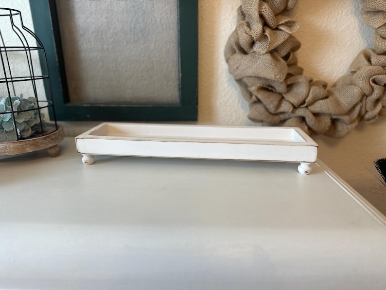 Rustic handcrafted wooden tray with smooth edges and a natural finish, available in customizable colors. The tray features a simple elegant design, perfect for serving as a decorative piece in any room.