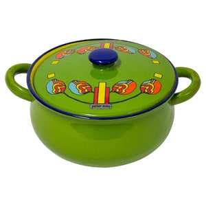 May include: Green ceramic pot with a lid featuring a colorful geometric design. The lid has a blue knob and the pot has the text "peter max" on the bottom.