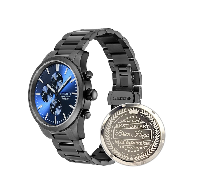 May include: A black stainless steel watch with a blue face and chronograph features. The watch has an engraved back with the text "To My Best Friend Brian Hayes Best Man Today, Best Friend Forever 10/29/2023".